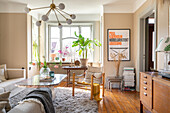 Living room with wooden furniture, flowers and plants