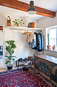 Hallway with wardrobe, chest and oriental rug