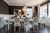 Festively laid dining table with Christmas decorations