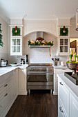 White kitchen with stainless steel hob and Christmas decorations