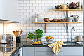 Modern kitchen with metro tiles and shelves