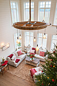 Bright living room with rustic chandelier and Christmas decorations