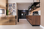 Modern kitchen with wooden elements and black accents, photo wall