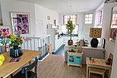 Open-plan kitchen with colourful decoration