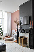 Living room with fireplace, painted walls, dried plants and candles