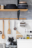 Kitchen shelf with utensils and crockery