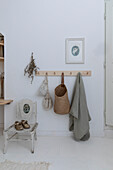 Wooden coat rack, children's chair and picture