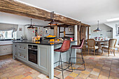 Country kitchen with wooden beams and adjoining dining area