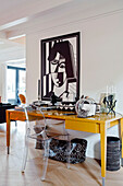 Modern workplace design with cubist mural and yellow desk