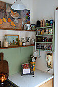 Kitchen corner with shelves, spices and kitchen utensils in vintage style
