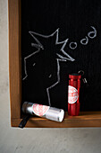 Torches and chalkboard with detective sketch