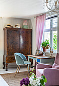Antique wooden wardrobe and desk with chair in a stylish ambience