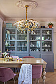 Dining room with crystal chandelier and display cabinet