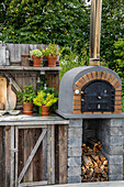 Stone oven and plant pots in a rustic garden setting