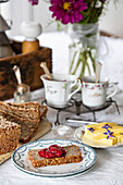 Breakfast table with wholemeal bread, butter and fresh jam