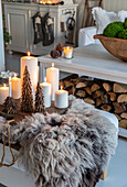 Christmas decorations with candles and fur in the living room