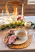 Festive Christmas table with candles and fir branches
