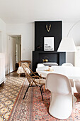 Dining room with white furniture and patterned carpet and tiled floor