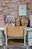 Workstation in front of brick wall with decorative storage baskets