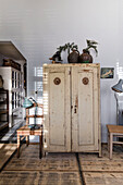 Antique, white cupboard with patina