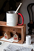 Vintage mug on a wooden crate with advent calendar boxes