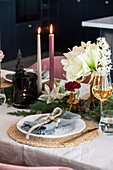 Festive table decoration with candles and flowers
