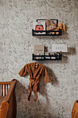 Shelves on patterned wallpaper in the children's room