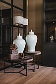 White porcelain vases on a side table in a modern living ambience