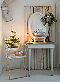 Old dressing table and chair in shabby style with Christmas decorations
