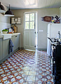 Country kitchen with antique floor tiles