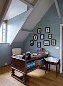 Antique desk and photo collection in the attic study
