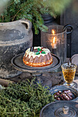 Cake with Christmas decorations on an antique cake platter