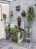 Patio area decorated with birdcages and plants