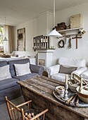 Country-style living room with rustic wooden table and candle holder