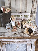 Antique kitchen cupboard with tea packs and tea accessories