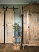 Rustic bedroom with sliding doors and wooden wardrobe