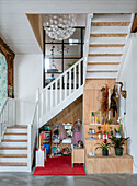 Staircase with integrated play corner and creative decoration made from natural materials