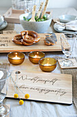 Table setting with wooden board with lettering Not perfect, but unique""