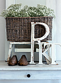 Decorative vintage basket with gypsophila and wooden letters