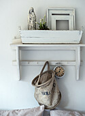 White wall shelf with vintage items