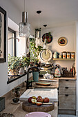 Rustic kitchen with wooden worktop, plants and retro accessories