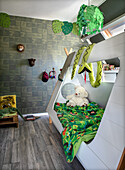 Modern children's room with wooden teepee bed, soft toys and jungle theme