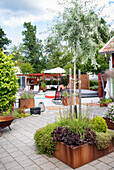 Modern garden area and terrace with raised beds made of Corten steel