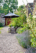 Seating on gravel path in the garden