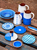 Ceramic crockery in blue and white on a rustic wooden pallet