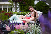Couple relaxing in garden