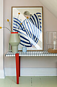 Hallway with modern sideboard, vase and abstract artwork