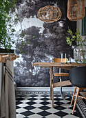 Dining room with photo wallpaper, rustic wooden table and rattan lamps