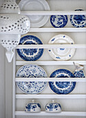 White shelf with blue and white country-style porcelain