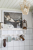 Vintage kitchen shelf with antique lamp and nostalgic picture